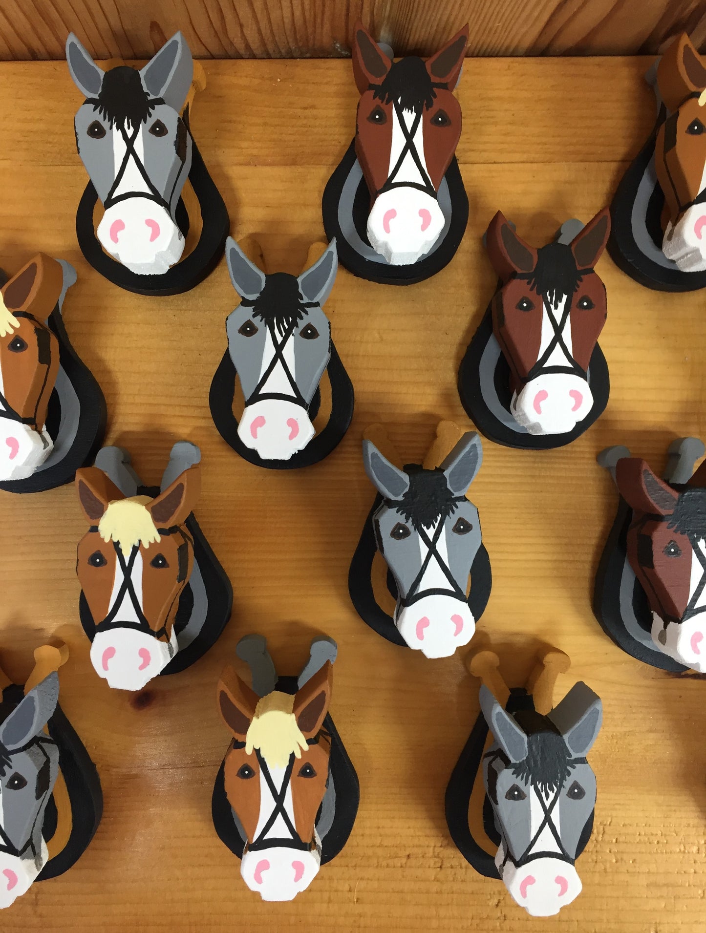 Handcrafted wood horse refrigerator magnets at Triple Mountain